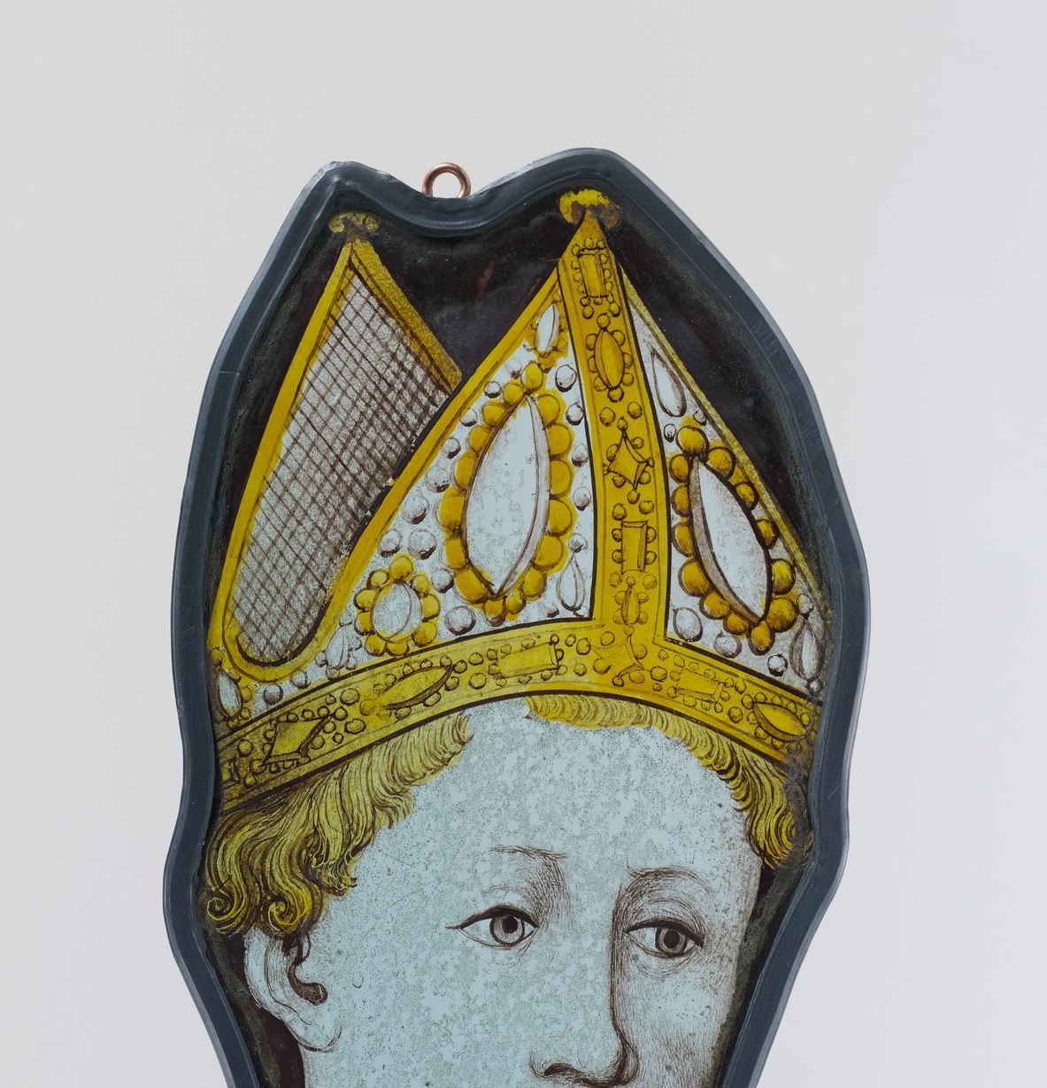 A bishop's mitre, golden against a deep blue ground.