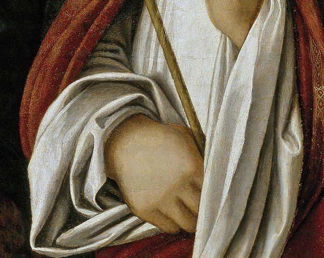 She shows quiet, pious hands.