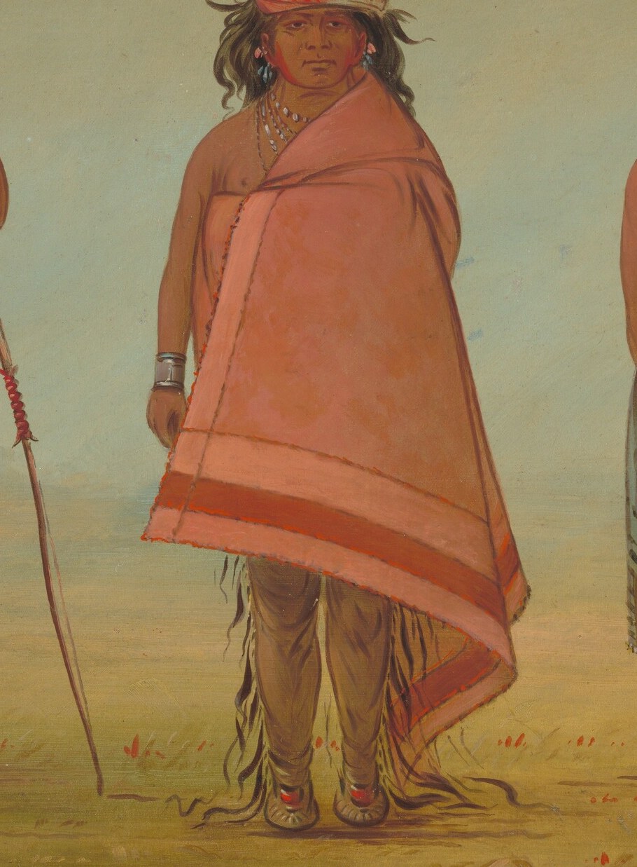 The vibrant color and geometric pattern indicate cultural significance and possibly wealth.