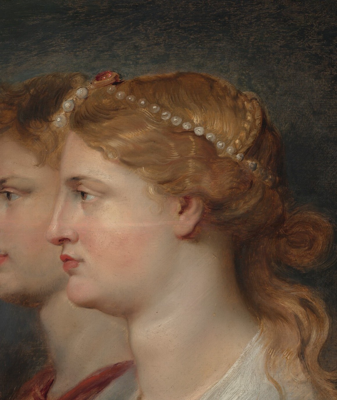 The dominant subject , her idealized complexion and serene classical features anchor the composition; Rubens unusually places the woman in the foreground, reversing the standard ancient-cameo convention of male prominence.