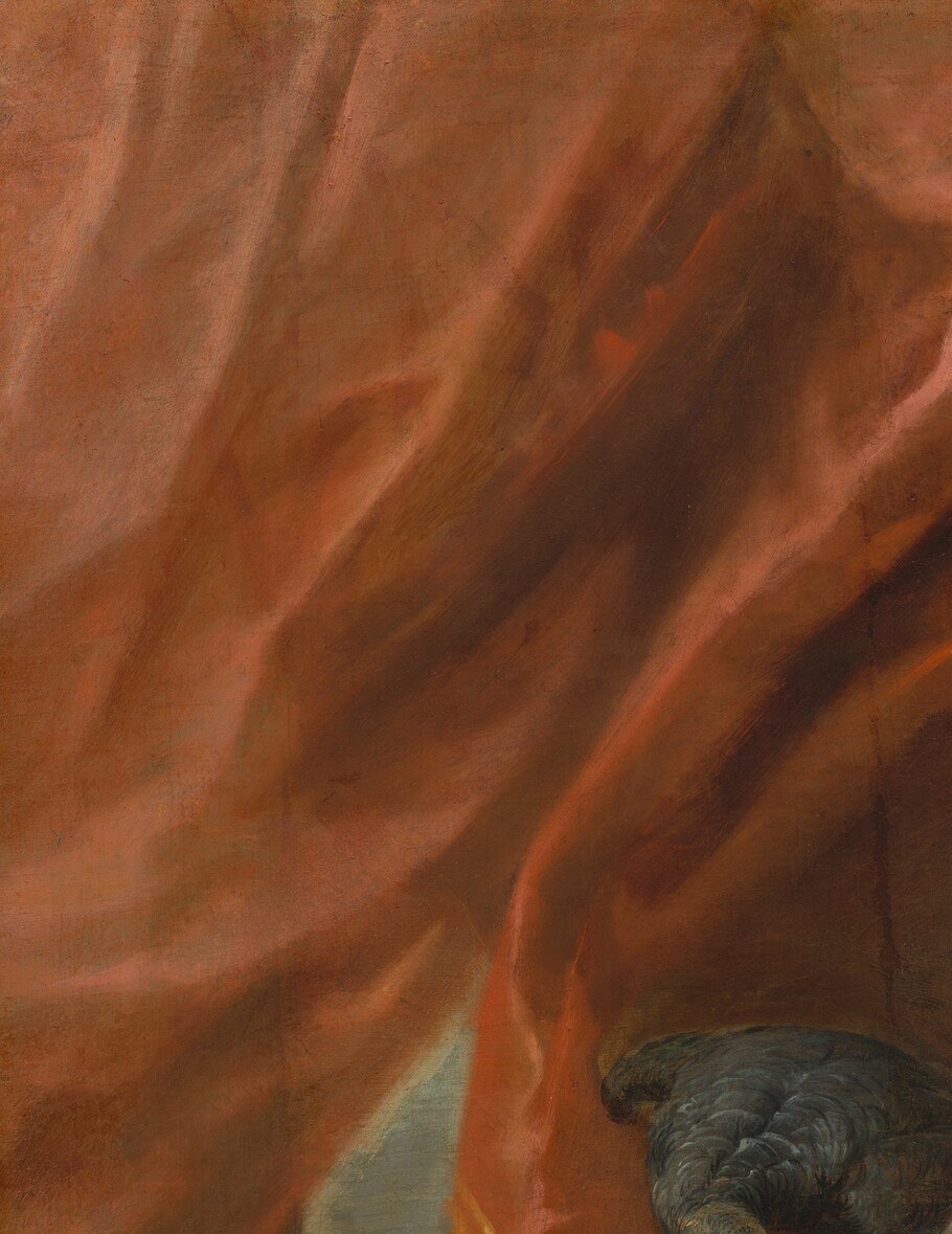 A Rubensian theatrical device that frames and warms the palette; its diagonal pull leads the eye toward the mother's face.
