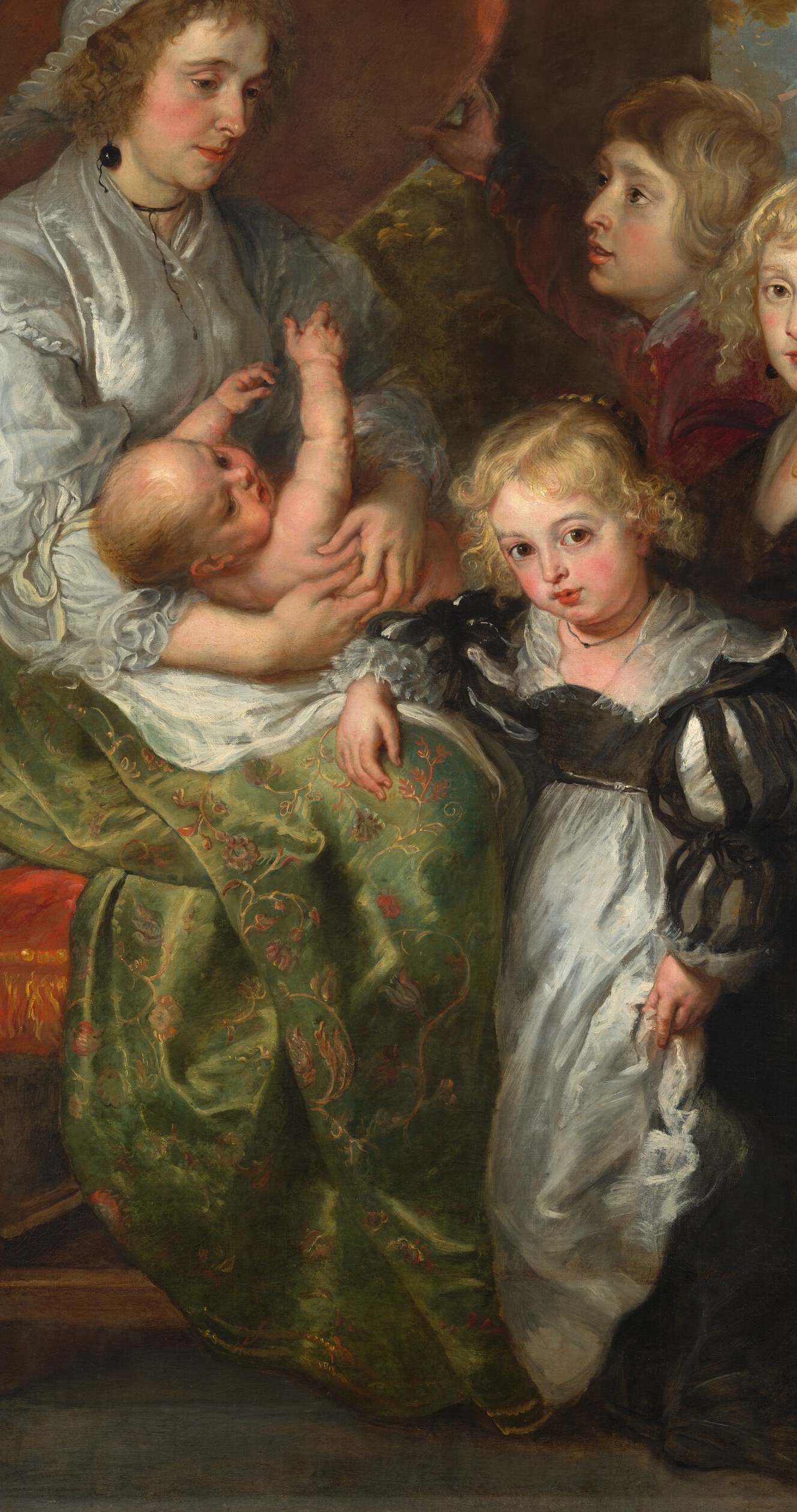 The most visually dominant figure; the luminous satin is a showcase of Rubens's fabric-rendering virtuosity and signals considerable family wealth.
