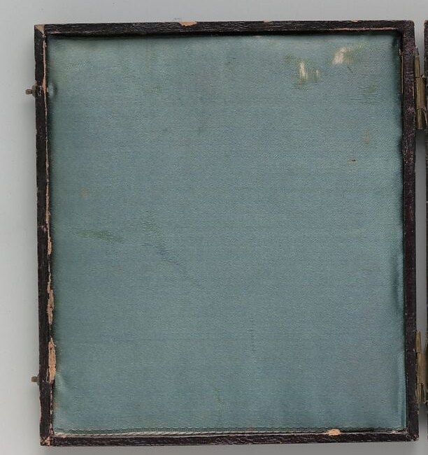A marginal but vital detail: the intact original case reveals the portrait was a private devotional relic meant to be held and opened, not displayed on a wall.