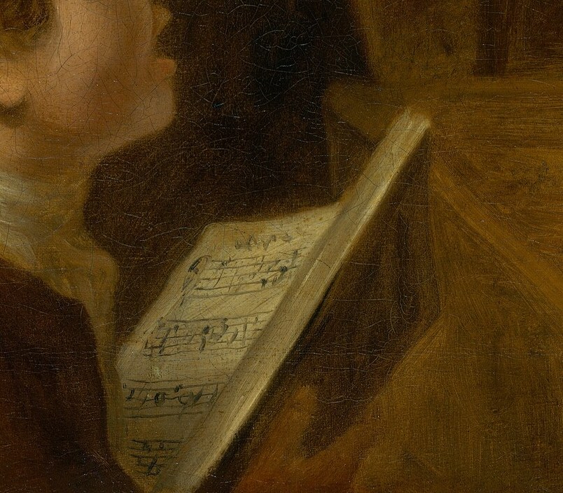 Even the younger man holds his own sheet music.