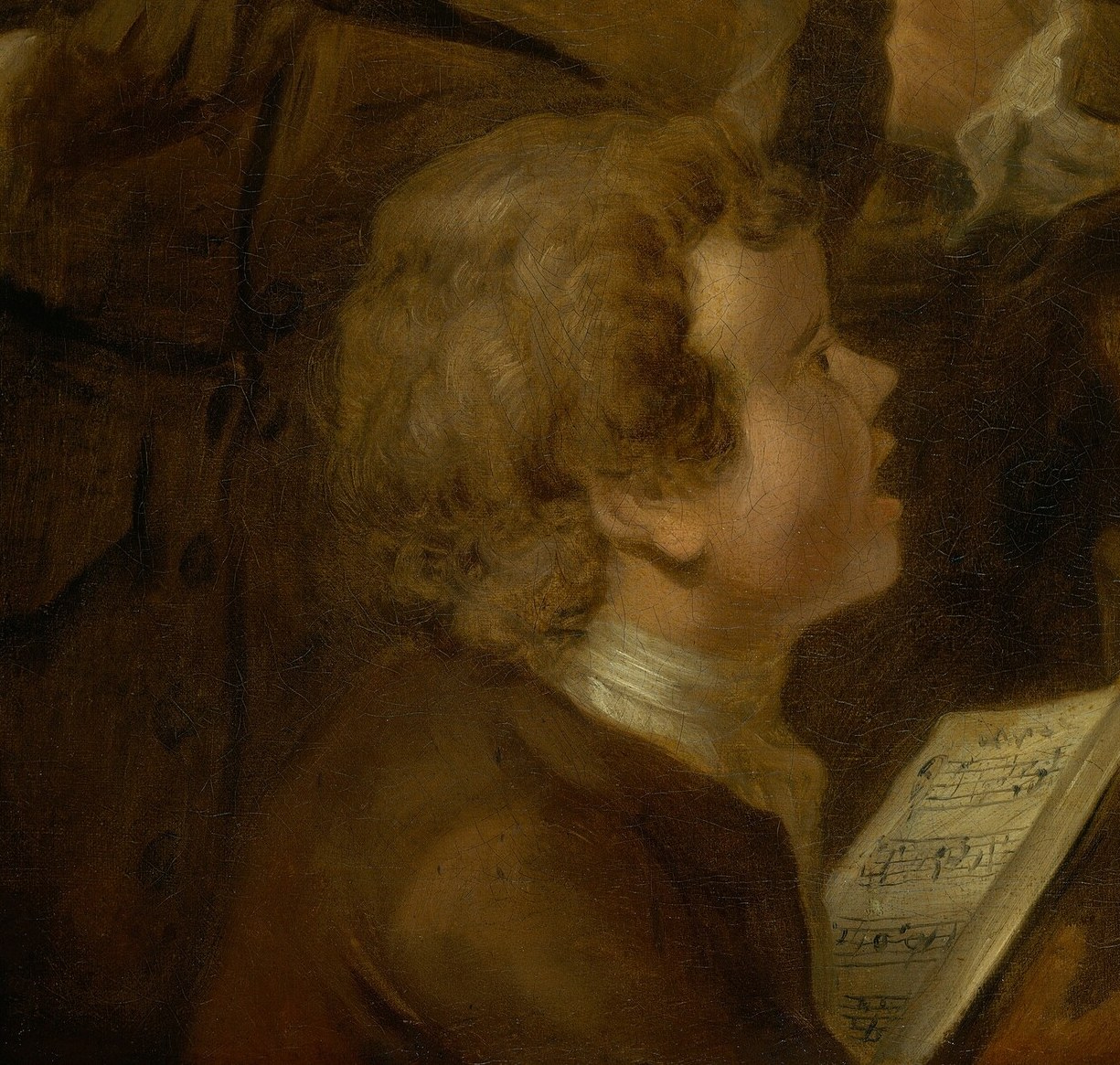 His upward gaze suggests he's actively participating in the song.
