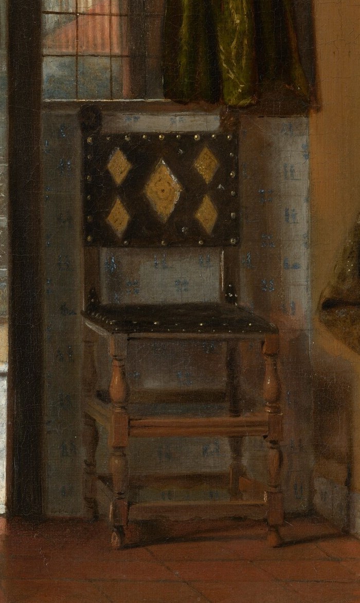 The intricate design of the chair adds a touch of luxury and visual interest to the domestic setting.