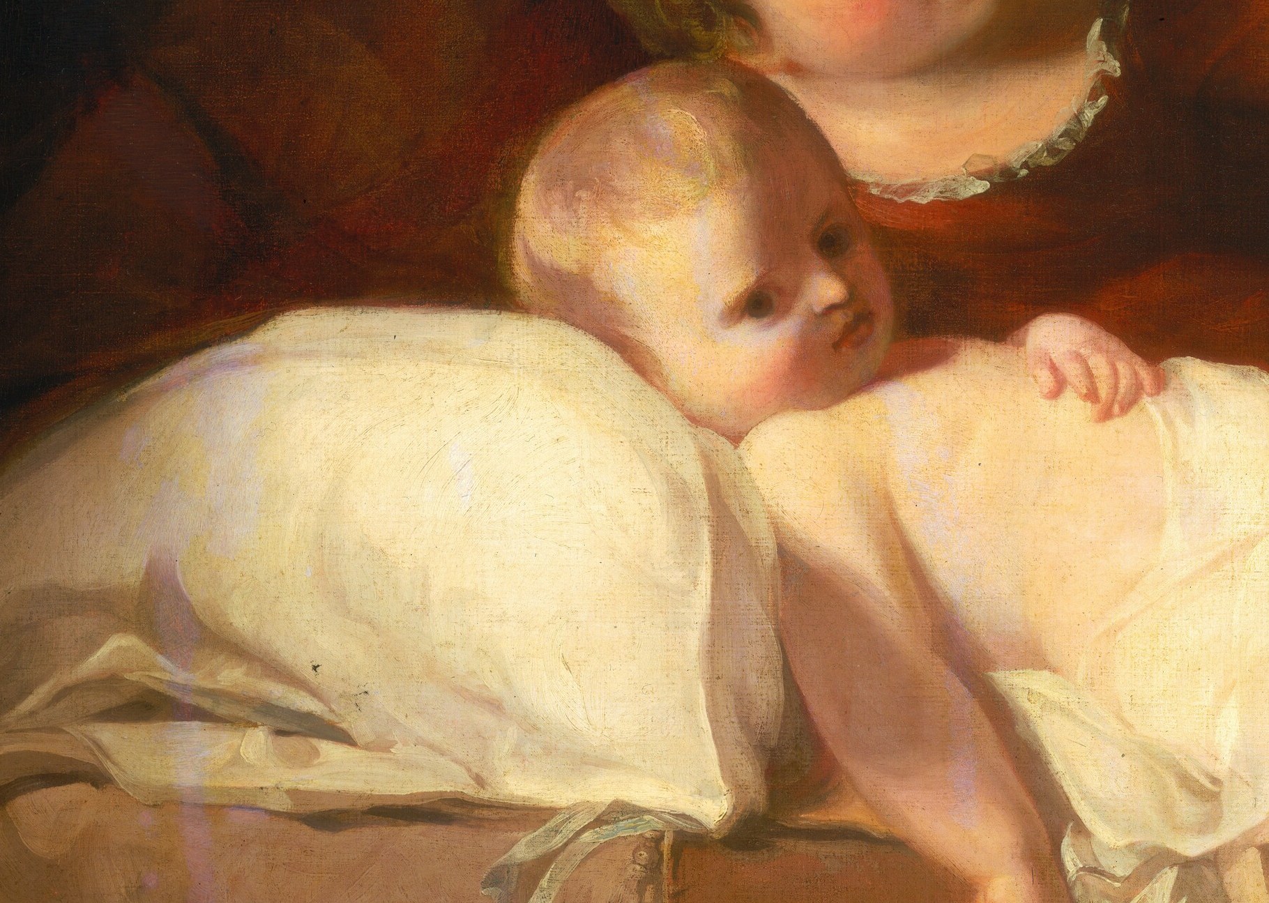 The baby's bare torso references classical ideas of innocence.