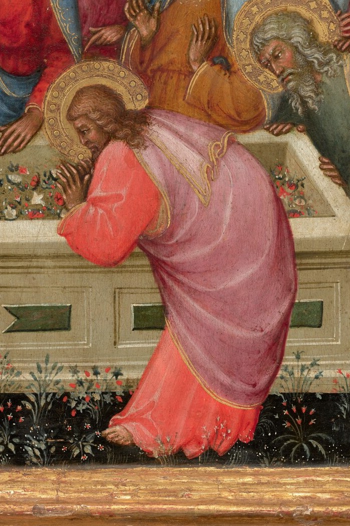 But look, Jesus is reaching into her tomb below.