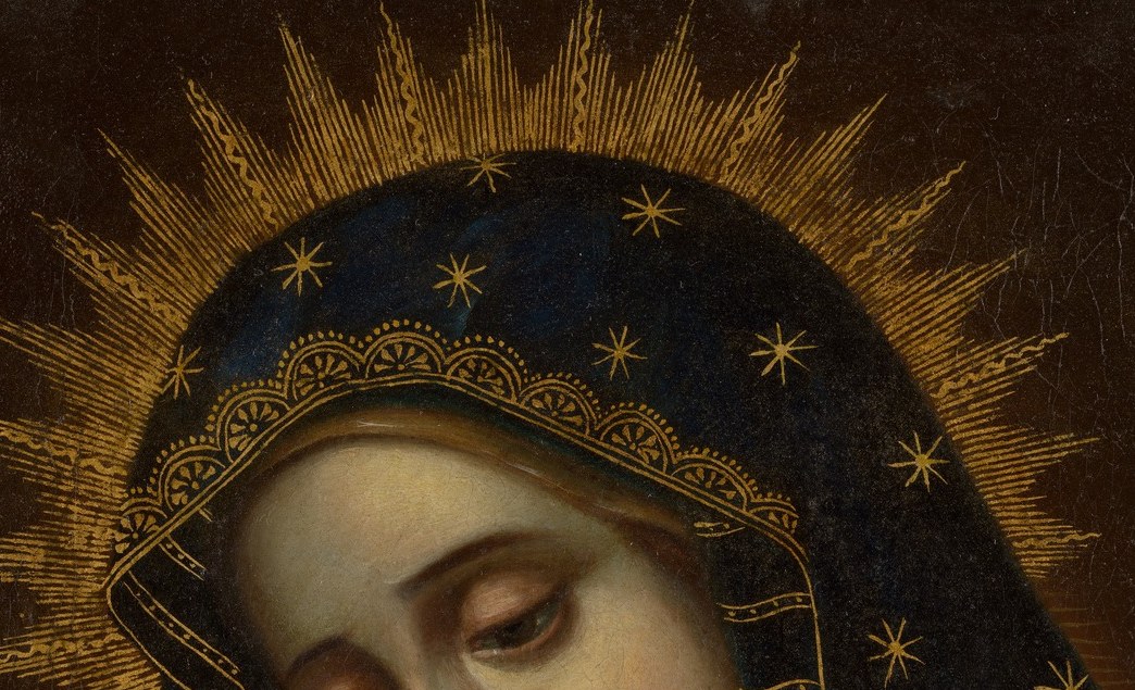 And her golden halo signifies her sanctity.