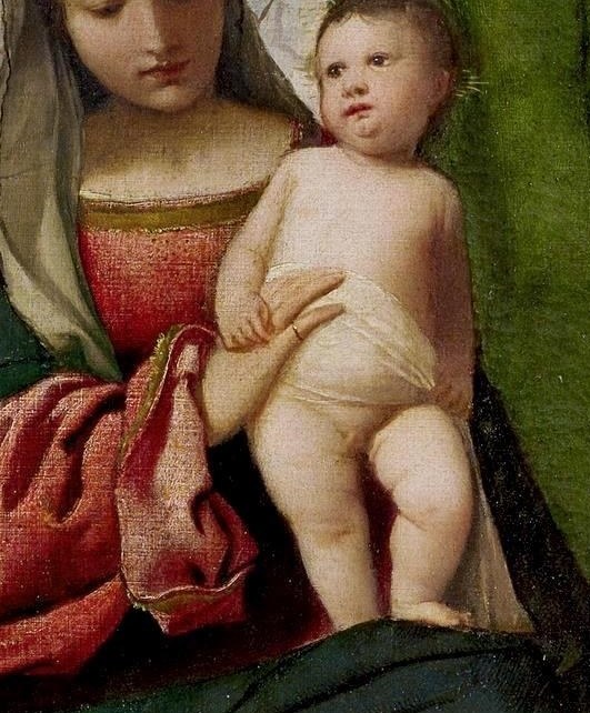 His innocent, lifelike form emphasizes his humanity and vulnerability.