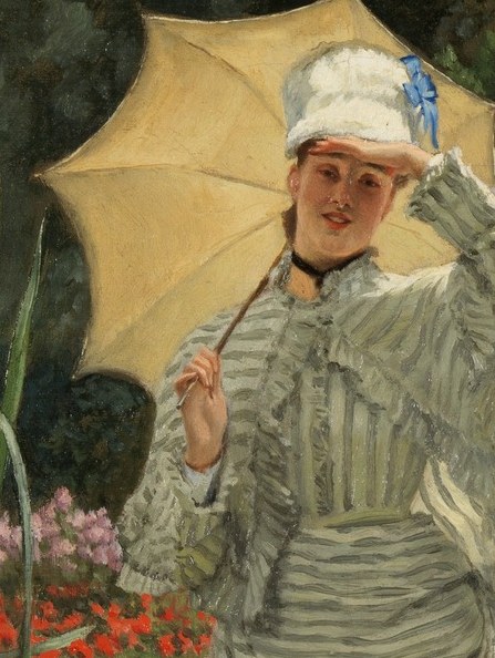Its bright, open form provides a striking contrast to the shaded garden and draws attention to the figure.