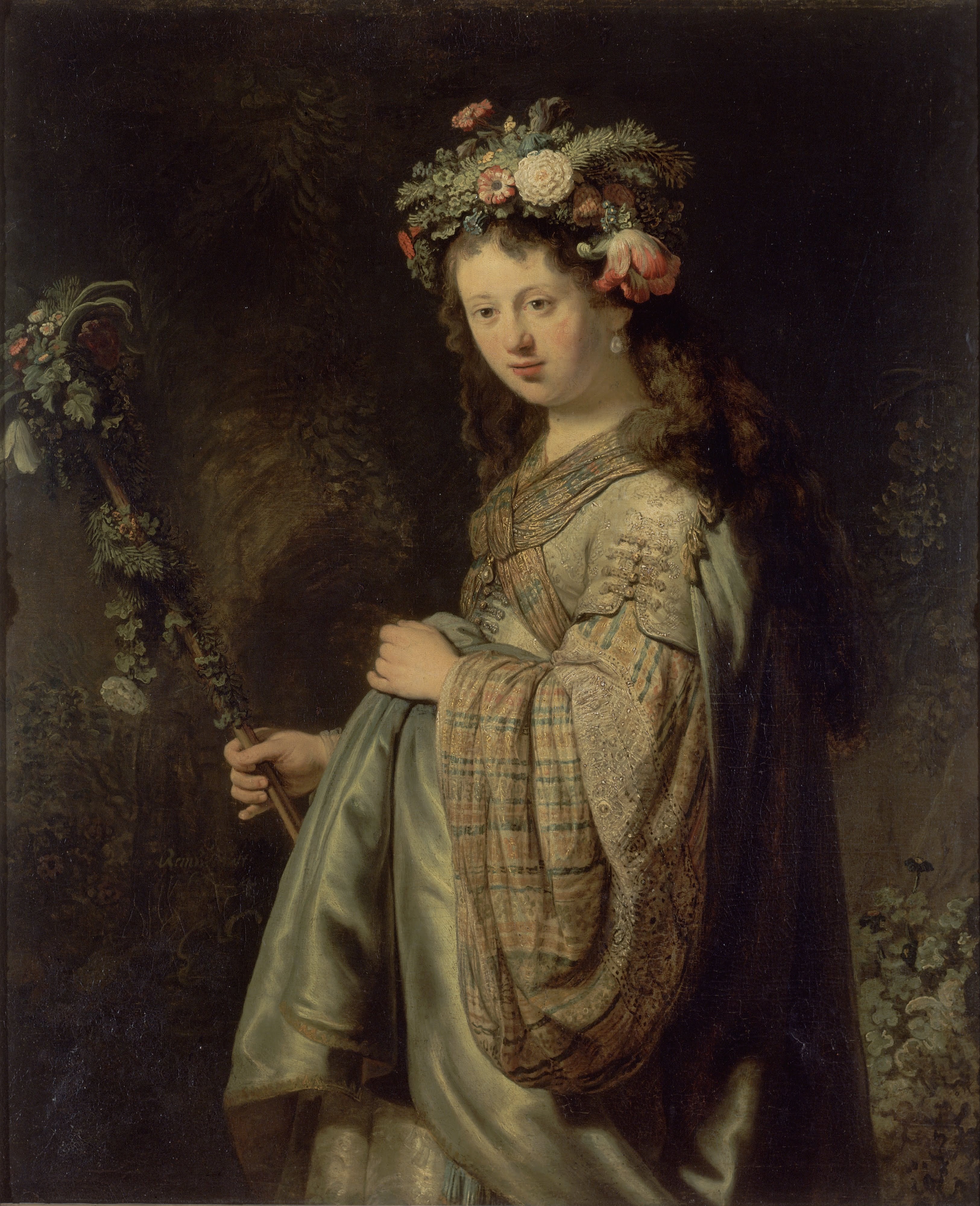 The deep, shadowy background creates a strong contrast, making the figure of Flora emerge dramatically.