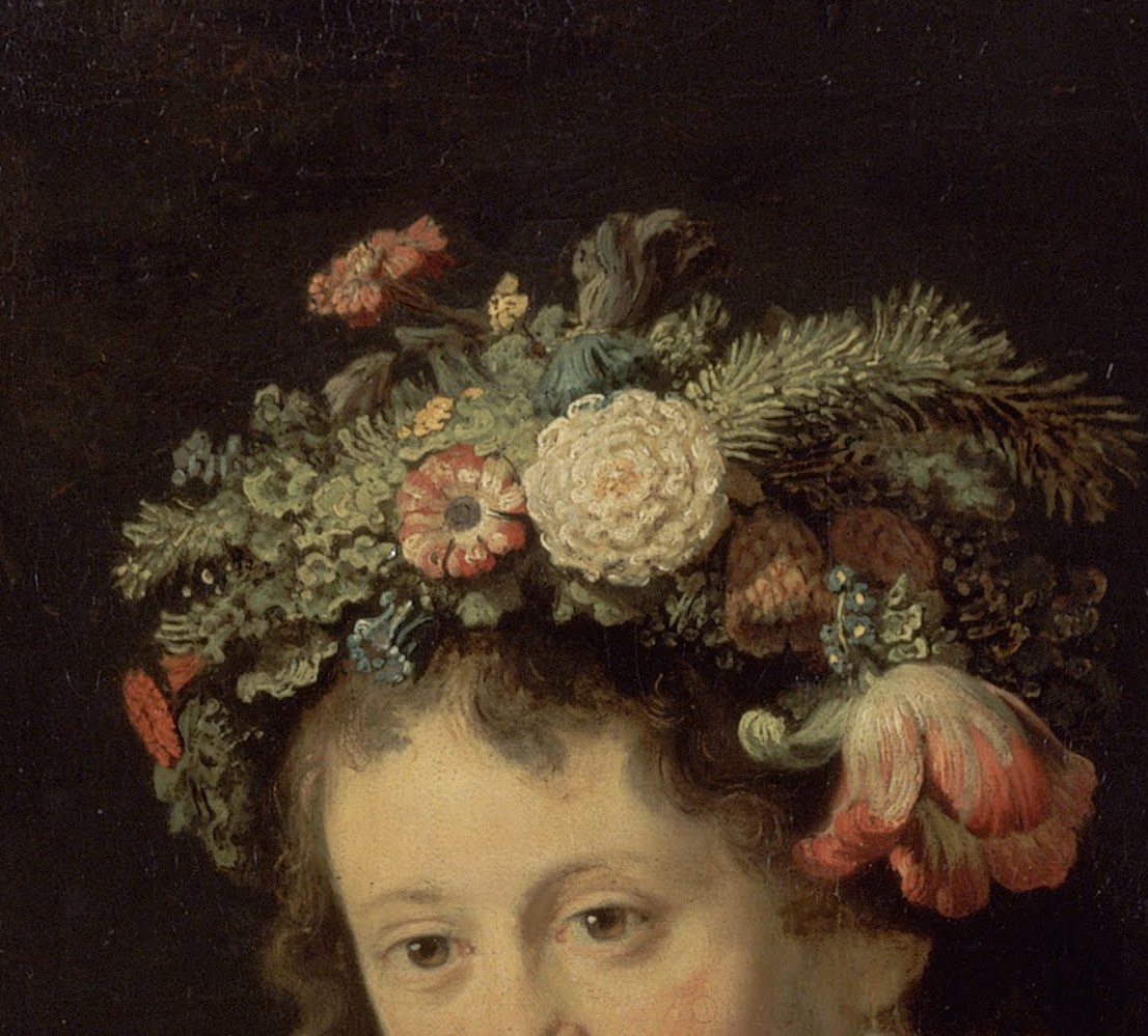 A profusion of blossoms and greenery, symbolizing spring and fertility, crowns her head.