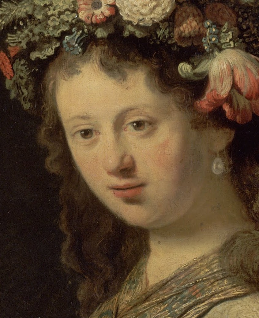 Her gaze is soft and slightly averted, conveying a gentle melancholy or introspection.