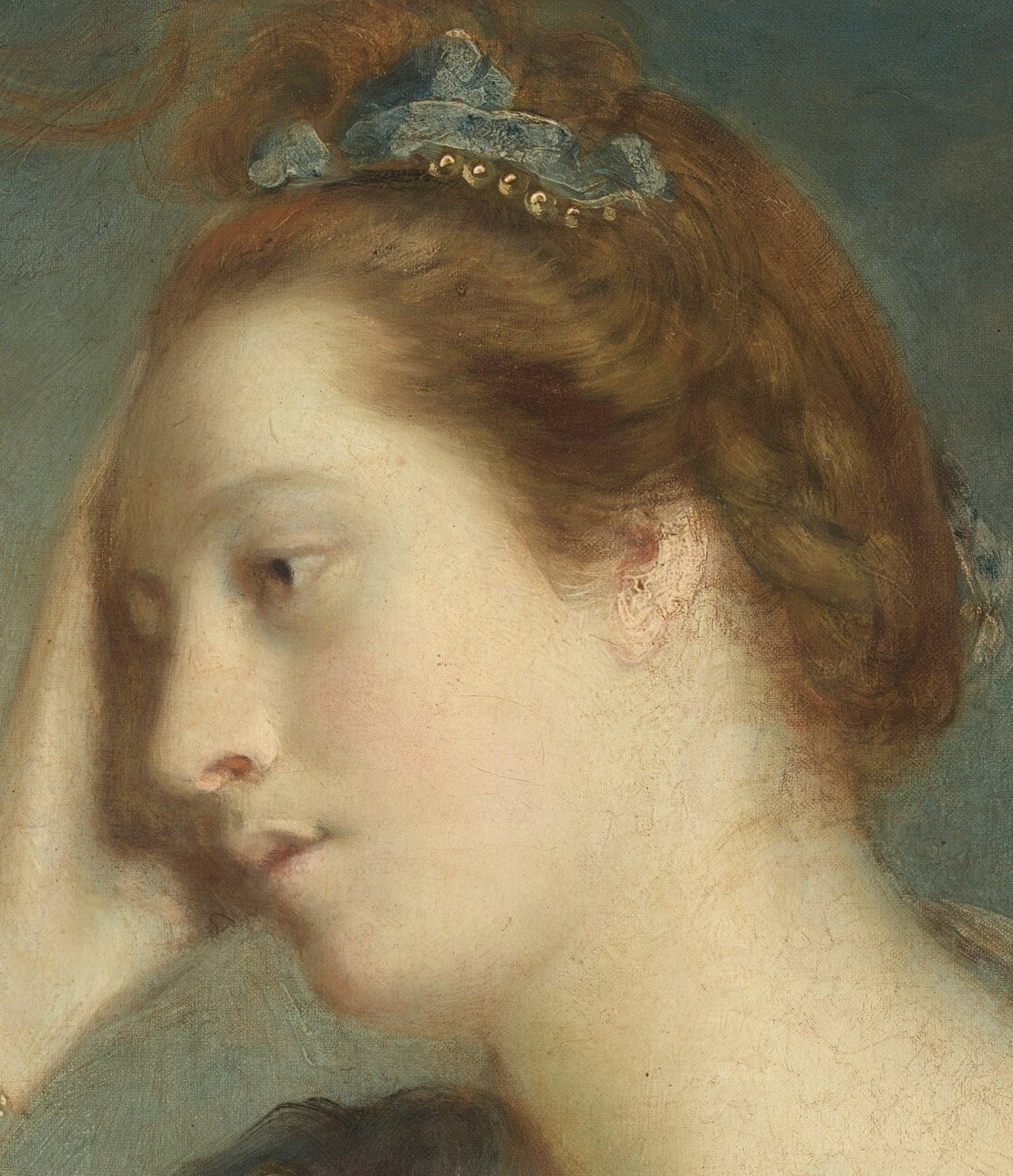 But her pose hints at a quiet weariness.