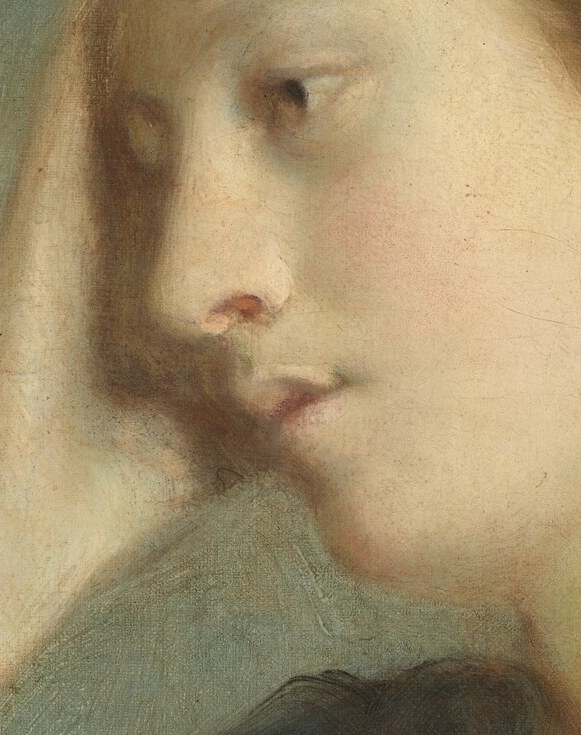 Her hand rests gently against her forehead.