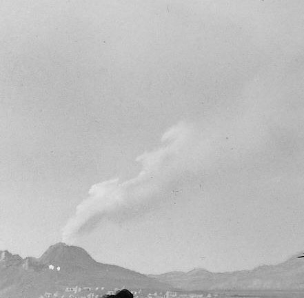 The volcano anchors the left horizon and supplies the sublime dimension; its presence turns a topographic record into a Romantic statement