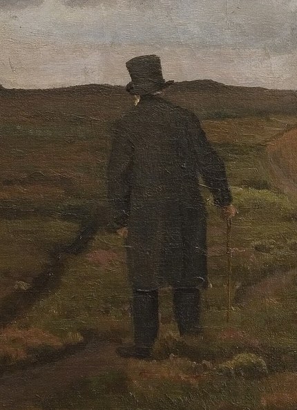 A lone traveler walks ahead.