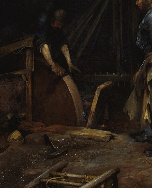 A man grinds tools to earn his family's living.
