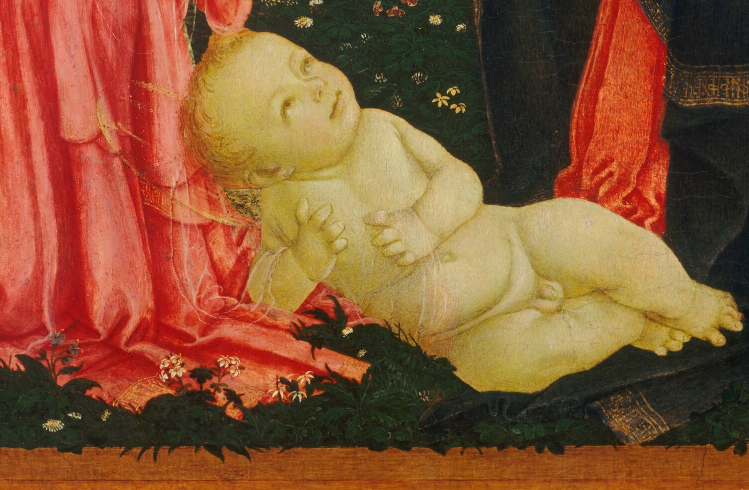 This subtle detail hints at both birth and future sacrifice.
