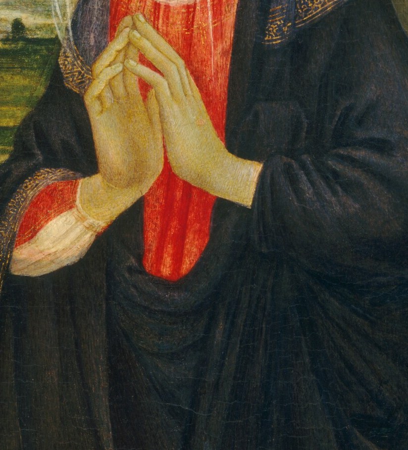 Her clasped hands hover, a gesture of suspended adoration.