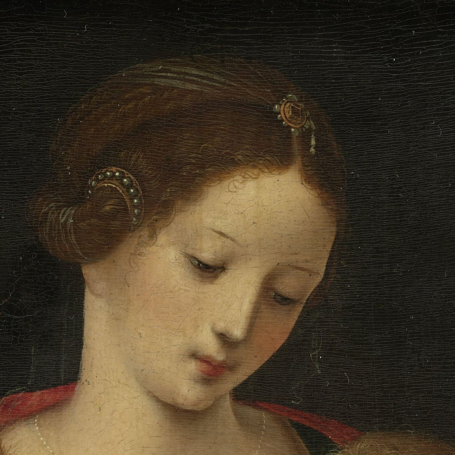 Her serene, downcast expression defines the emotional register of the whole painting , quiet devotion without sentimentality.