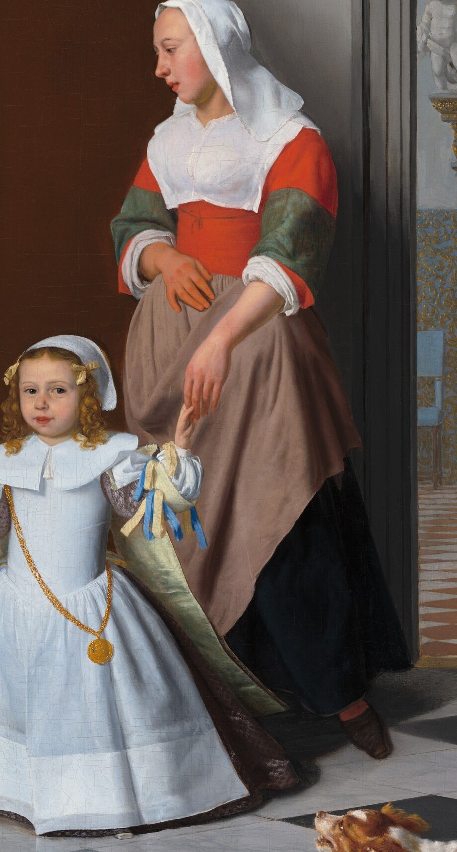 Look at how gently she holds the child's small hand.