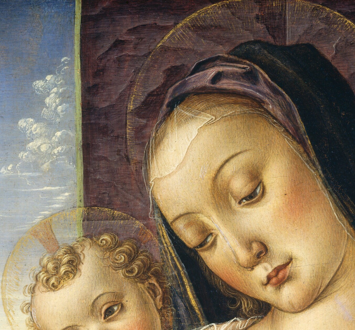 Her gentle downward gaze , eyes averted, brow relaxed , anchors the painting's devotional tenderness; the slight tilt creates an axis of attention aimed at the child.