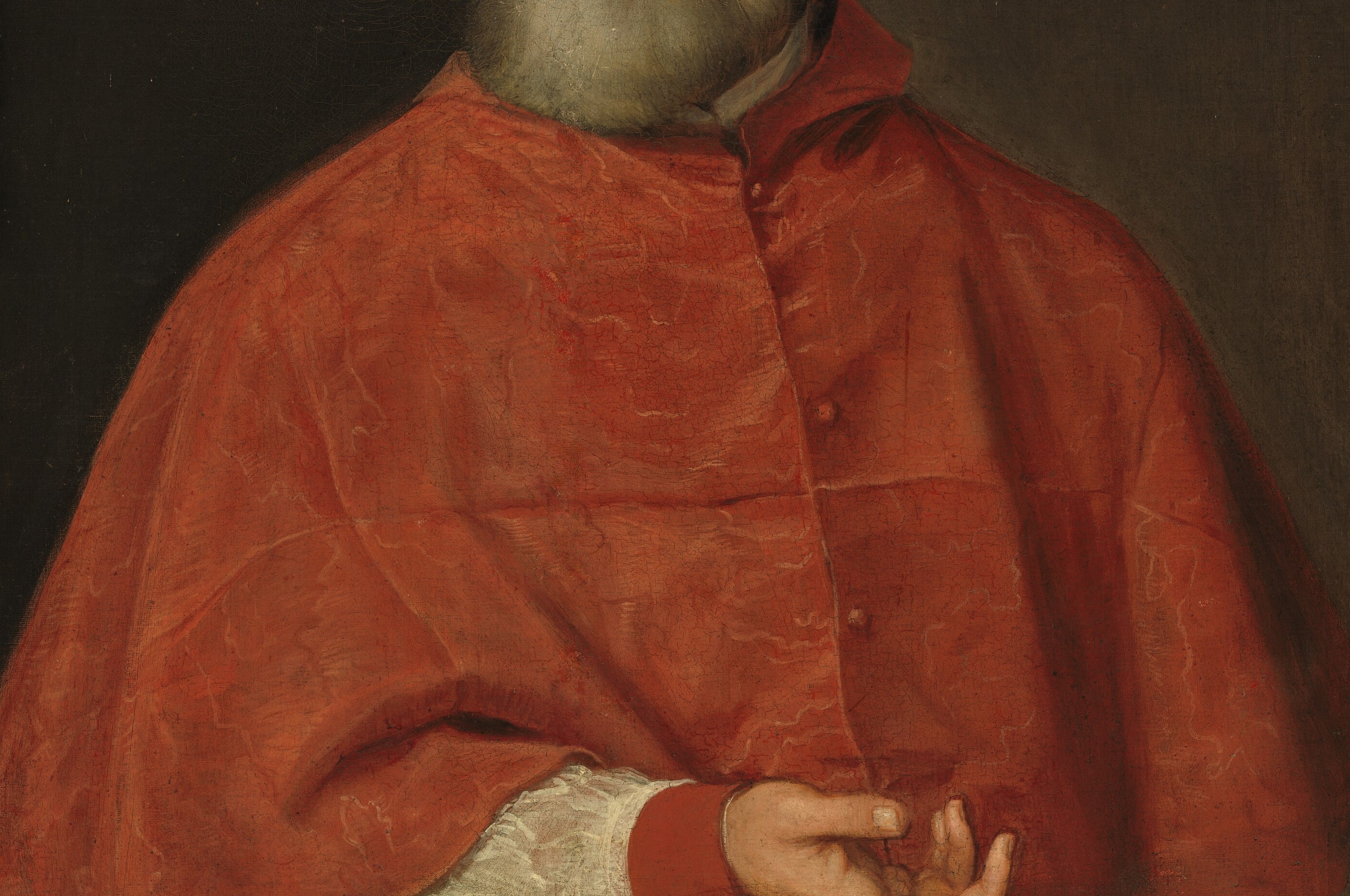 Titian paints the scarlet velvet with loose, almost casual strokes.