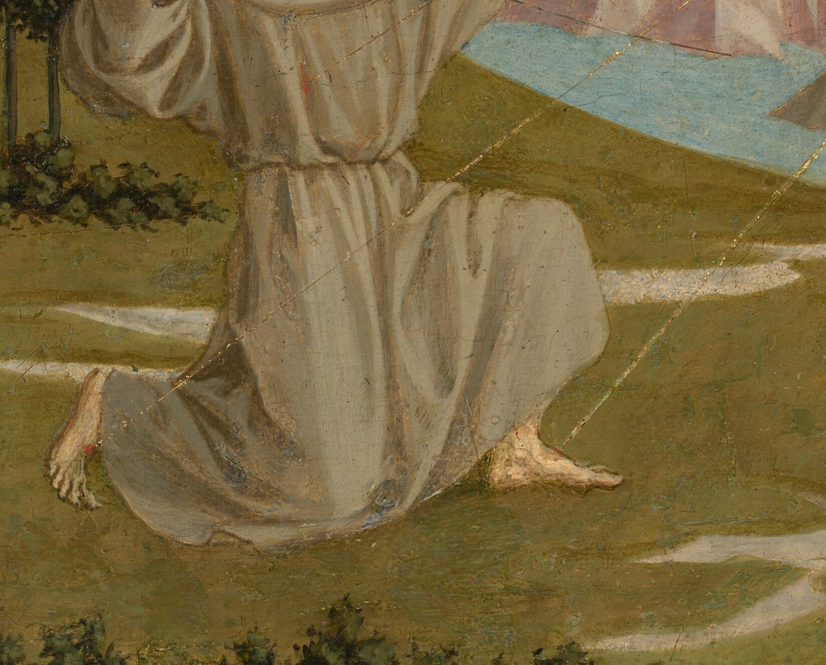 But look closely at the figure next to him.