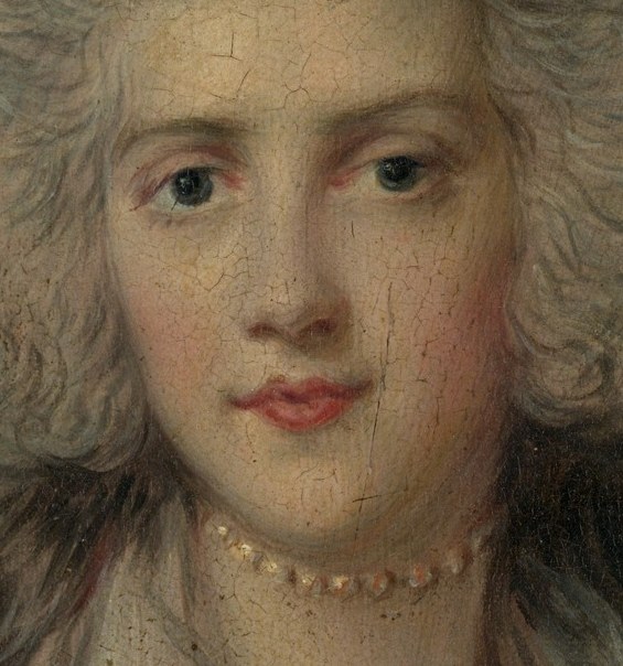Her expression suggests quiet confidence and composure.