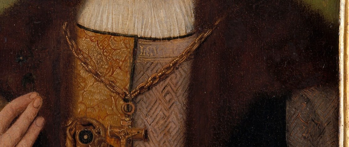 His clothing, rich with fur and gold, speaks of status.