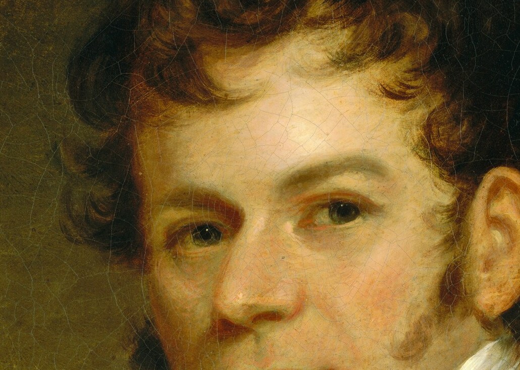 His dark, curly hair was a fashionable style of the time.