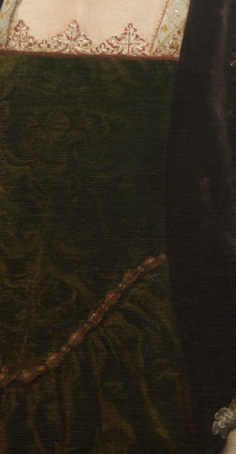 Look at the dark green fabric of her dress.