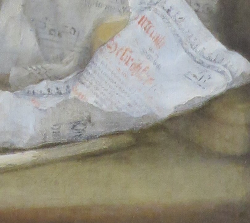 Now look closely at the crumpled paper on the table.