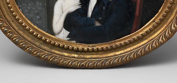 Look at the father's hands. He isn't just posing. He's holding her.