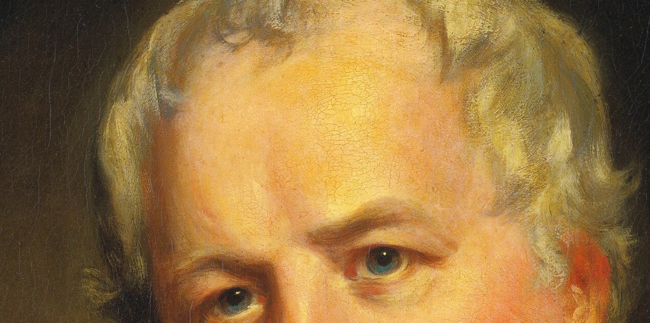 The whitened hair suggests his age and adds to the dignified portrayal.
