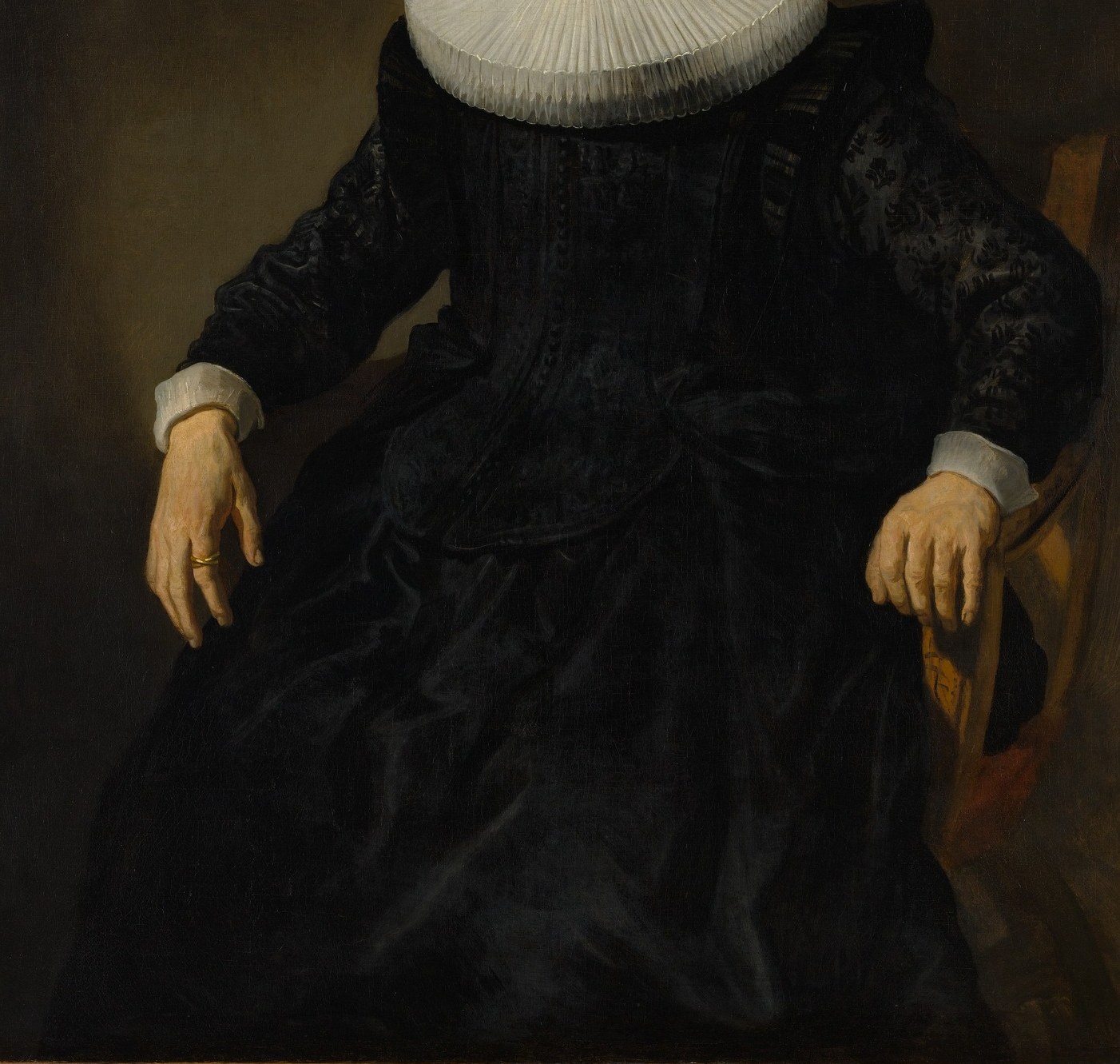 The black void of her dress erases the body entirely.