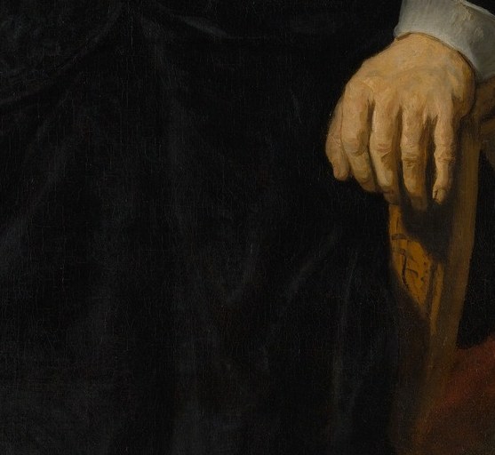 Her clasped hands complete the code: stillness means dignity.