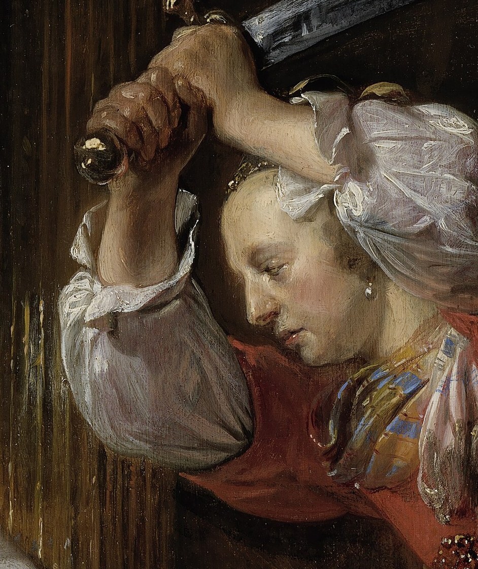 She raises the blade. Her jaw is locked.