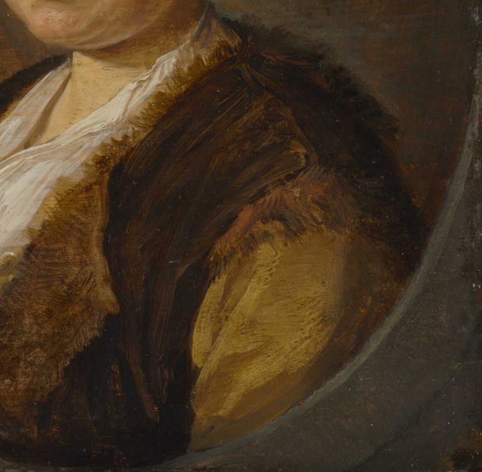Rich fur trim suggests her status.