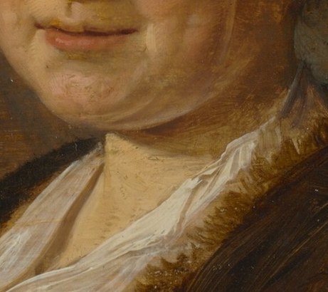 The stark white collar emphasizes her skin.