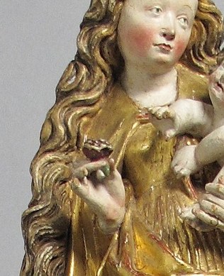 Only the upper half survived, with the Virgin and Child at its heart.