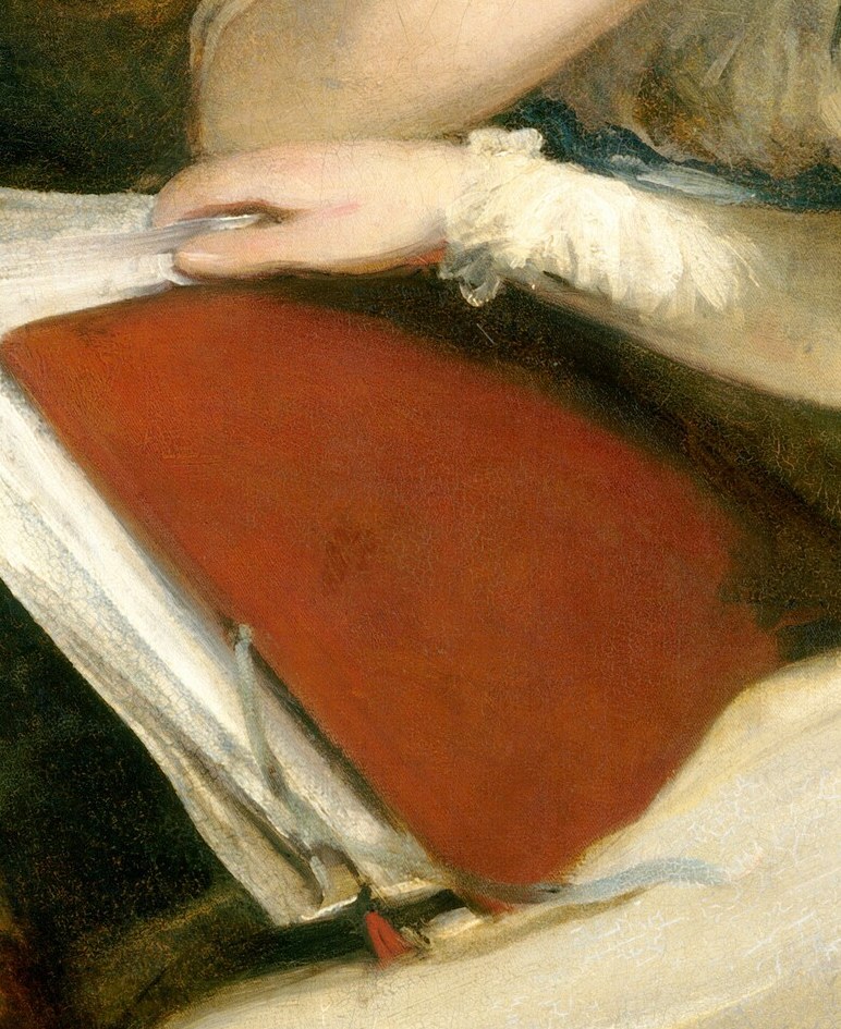 A shared book, a quiet moment, a sleeping dog.