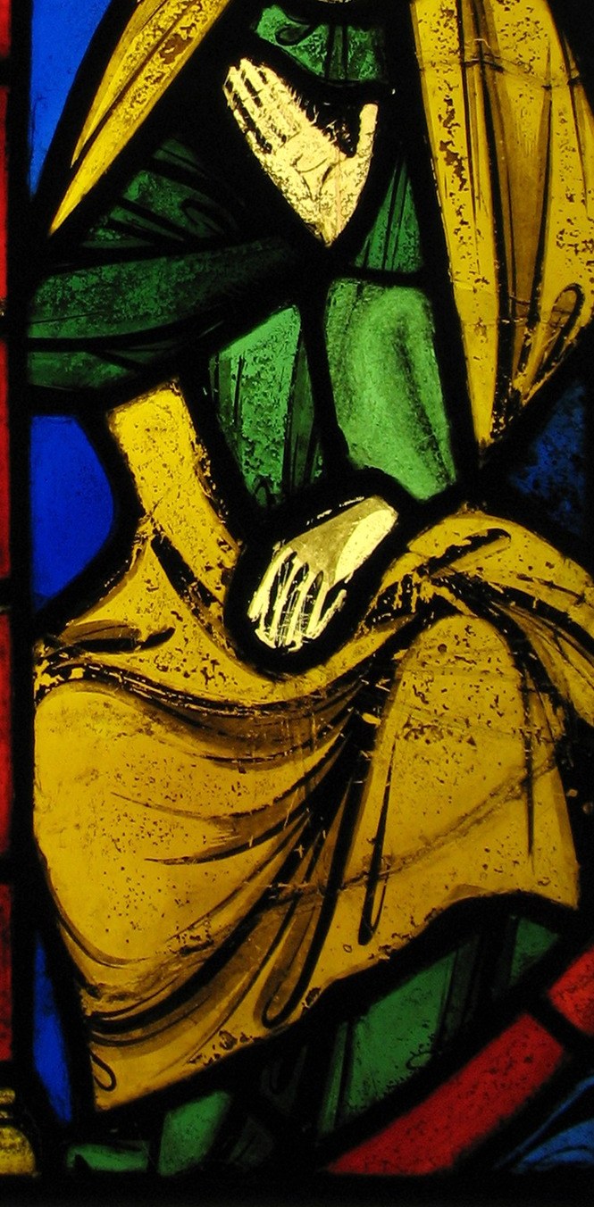 The Virgin wears a green robe under a gold mantle.
