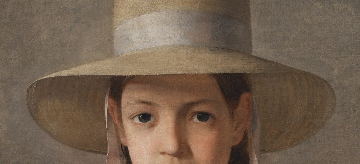 The hat casts a shadow, adding depth and framing the girl's face.