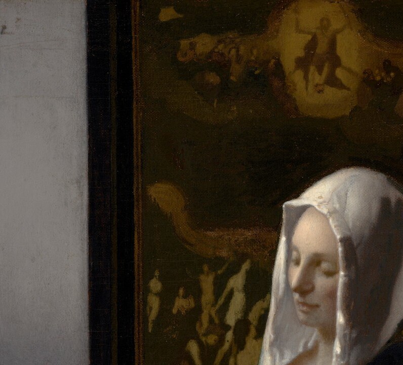 carries Marian connotations of purity; also Vermeer's device for catching and diffusing window light across her face