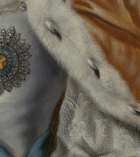Even the delicate lace cuff appears woven thread by thread.