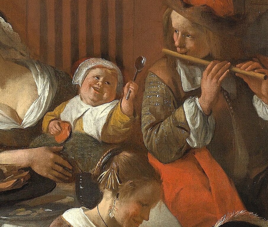 His focused expression and the instrument suggest a more refined musical contribution, contrasting with the general merriment.