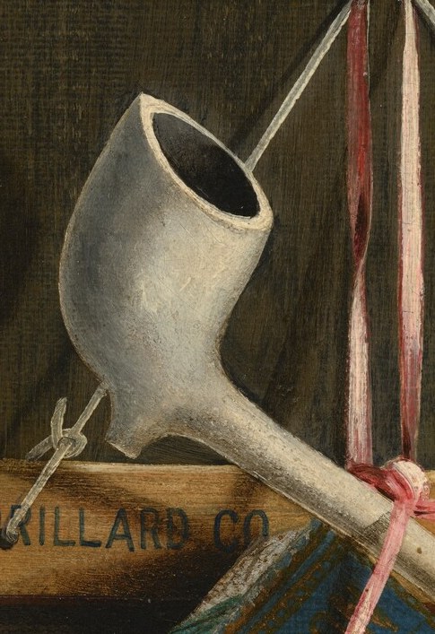 Its smooth, cool surface contrasts with the rough wood and tobacco, suggesting a moment of quiet contemplation.